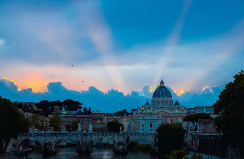 beautiful sunset over the historic city skyline and lake in rome