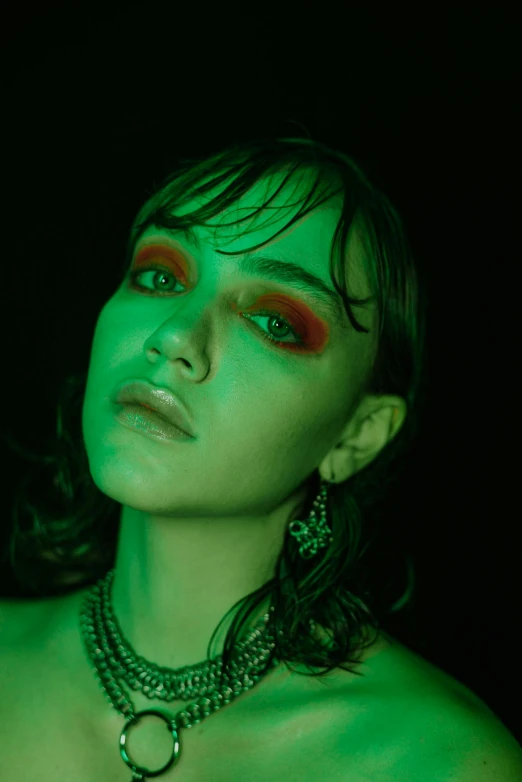 a beautiful woman with red makeup and jewelry