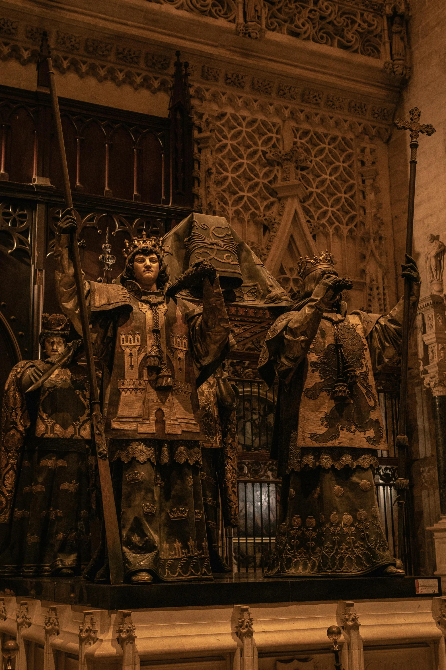 an ornate room with statues and wood carving on the walls