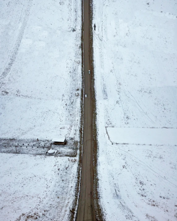 a car that is driving on a road in the snow