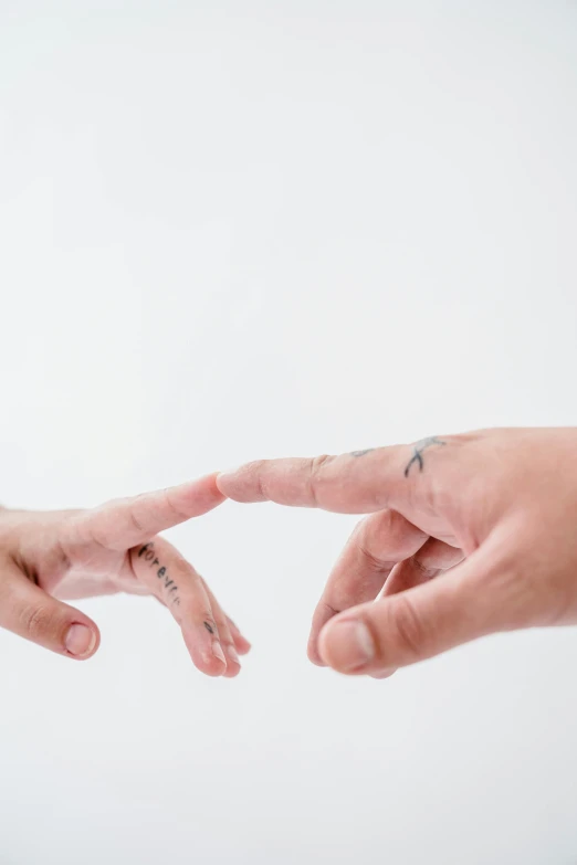 two people giving each other two fingers