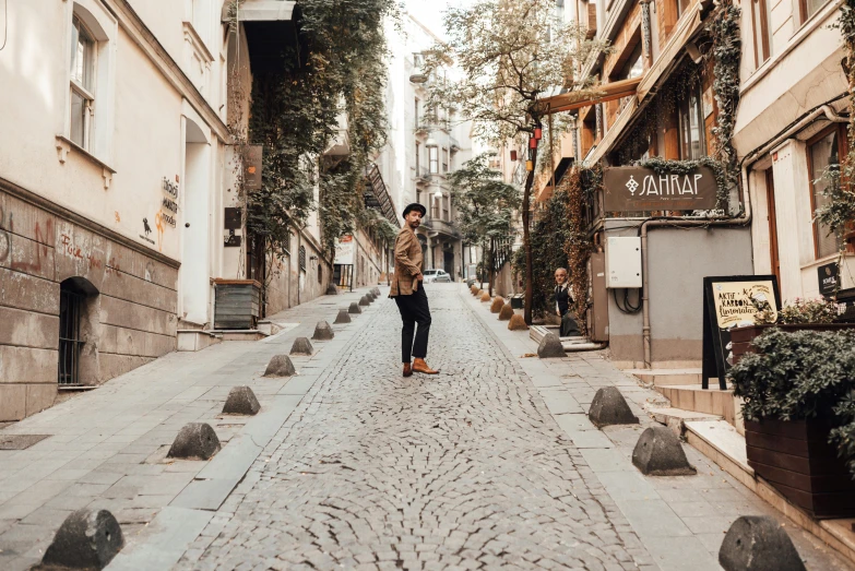 a person standing in the middle of a city street