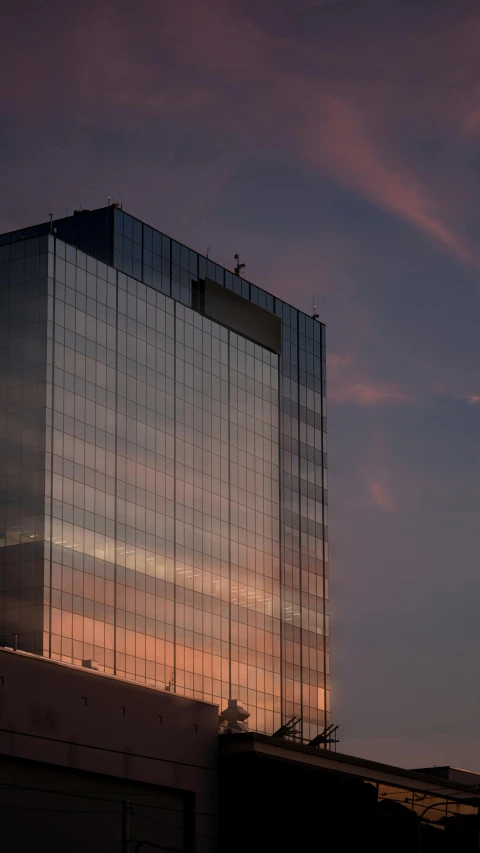 a plane flying over the top of a building