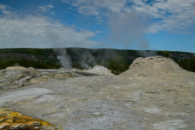 some very large white rocks with steam coming out