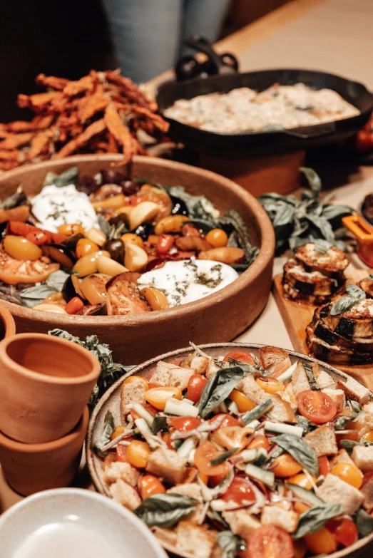 several plates with different dishes in them