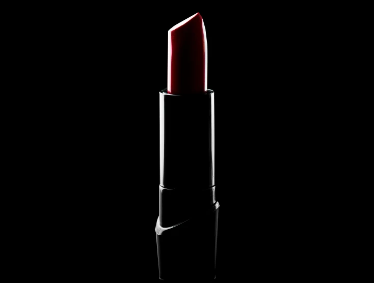 a bottle of liquid lipstick on a black surface