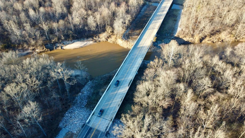 a road bridge going across a wide body of water