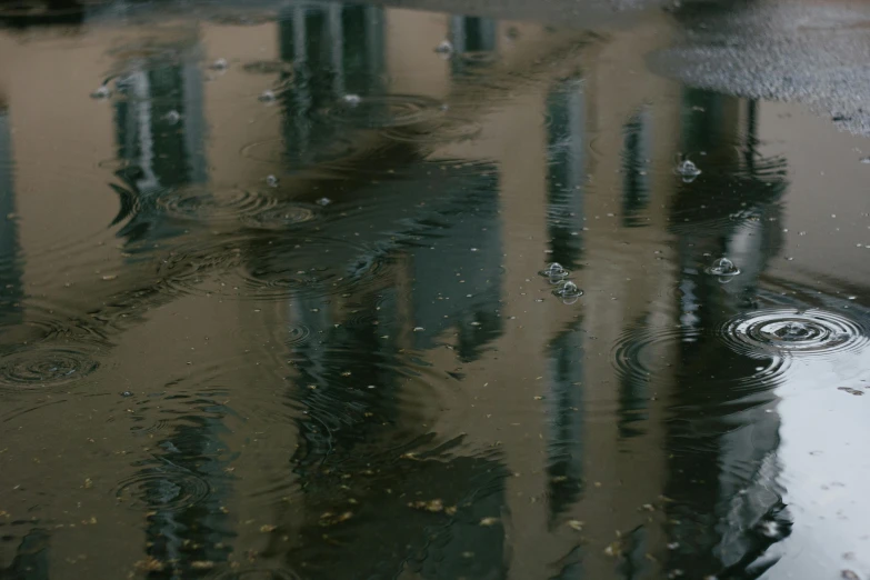 the building in the reflection has a lot of rain