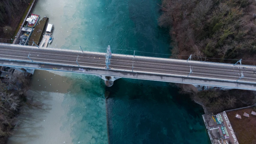 an aerial s of the railroad bridge spanning the width of the river