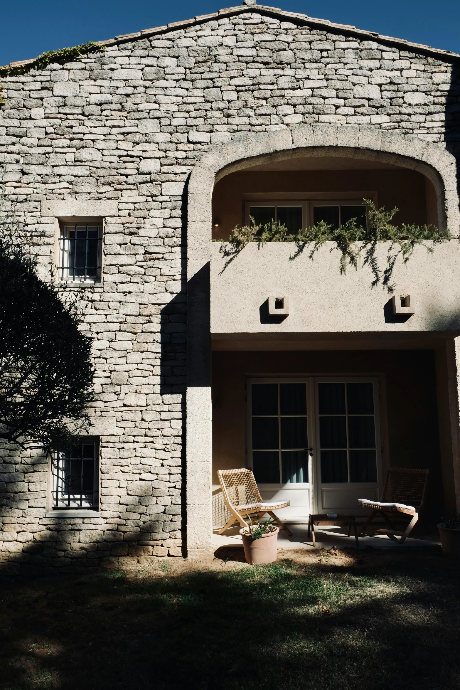 a very tall brick building sitting next to a patio