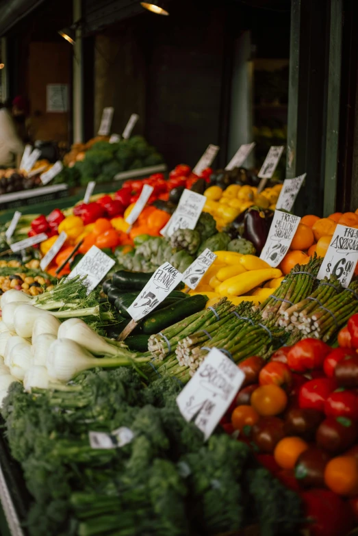 fresh fruit and vegetables on display at a market