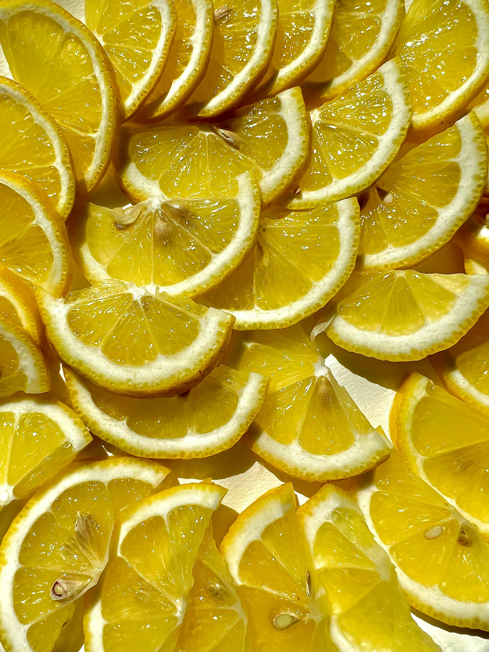 an image of a tray full of lemons that are sliced up