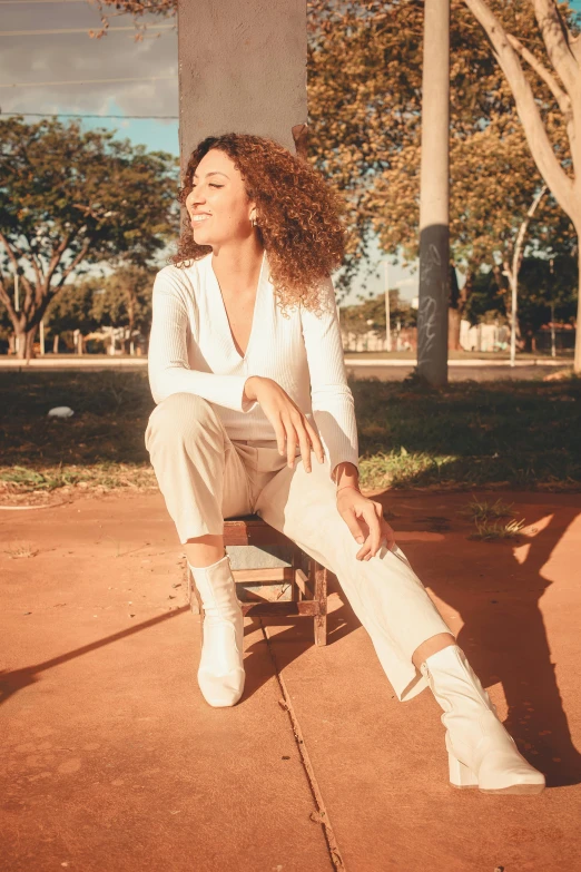 a woman sitting down with a foot on the floor