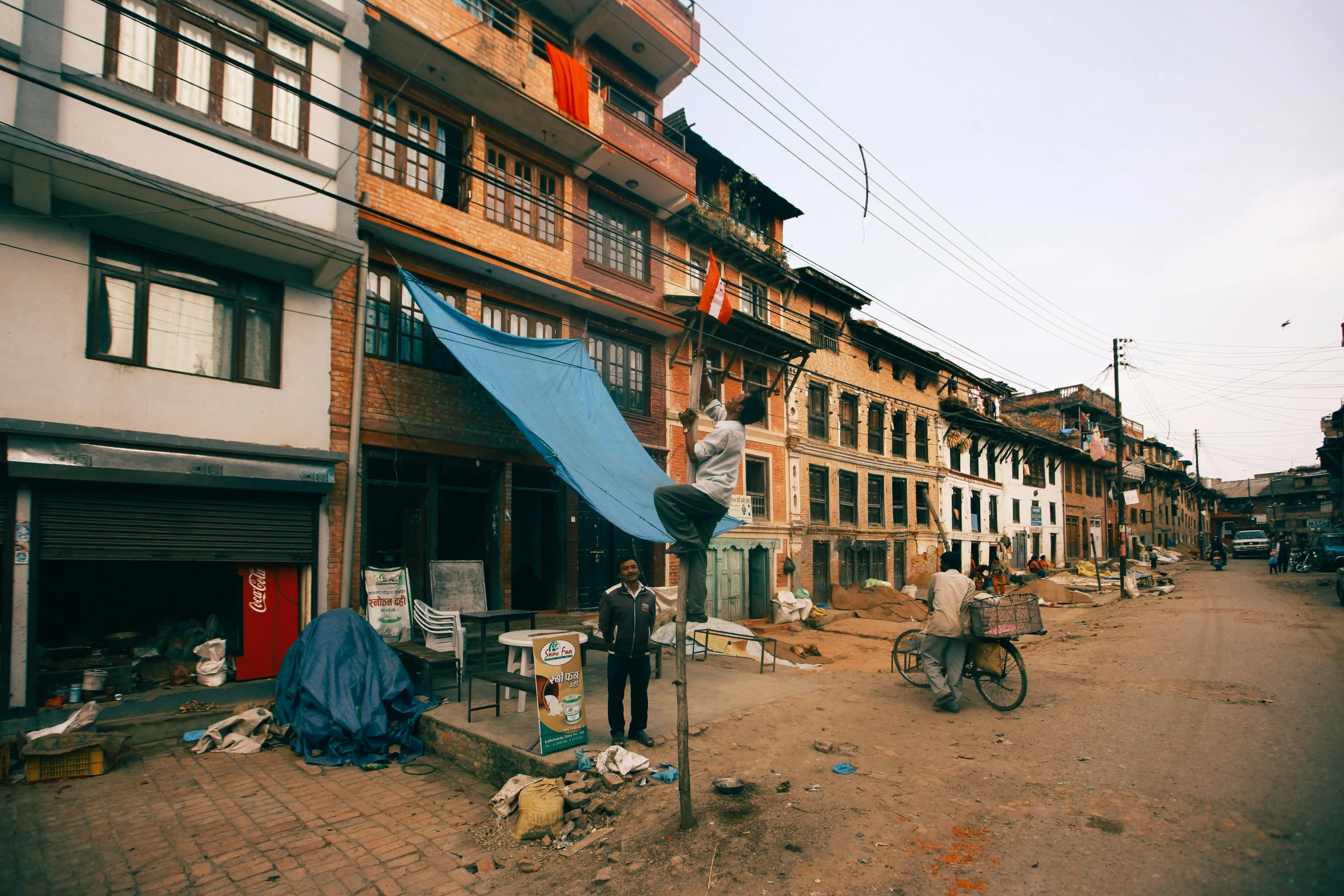 a street with many buildings and people walking