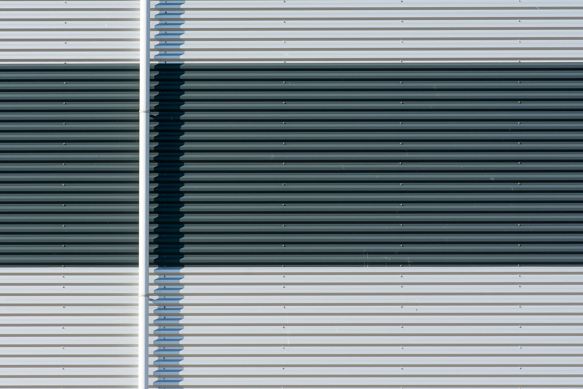 three rows of horizontal blinds that are made of metal