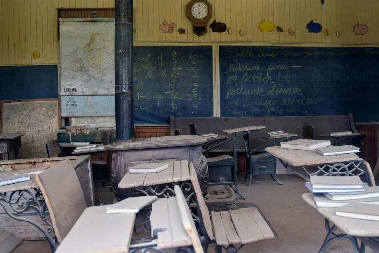 there are desks and chairs that are in an abandoned school