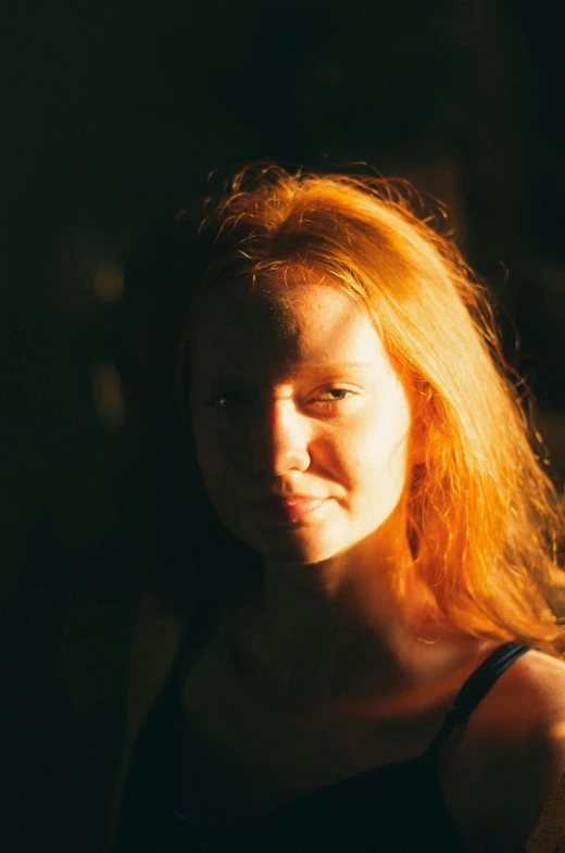 a close up of a person with long red hair