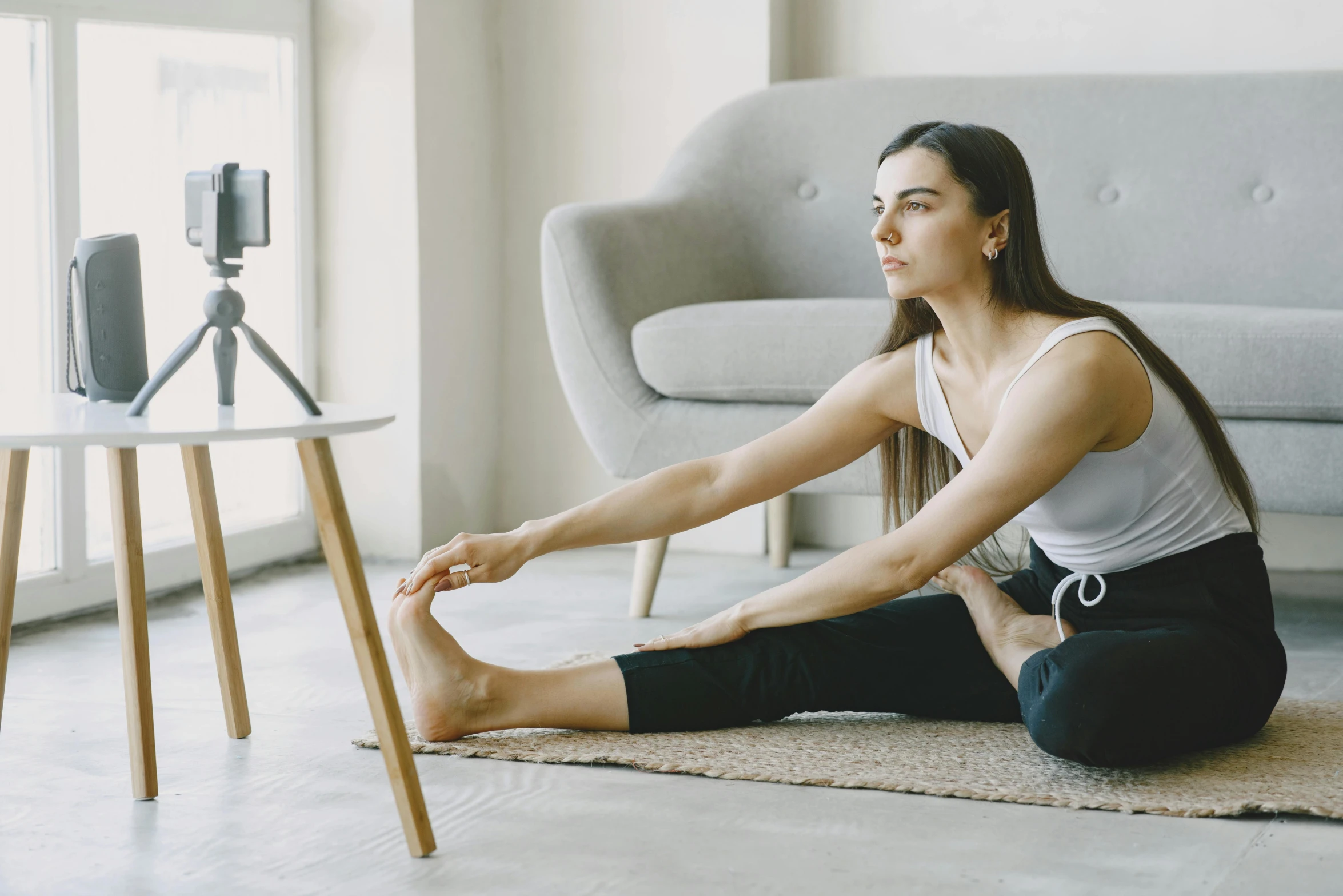 the woman is doing yoga with her 