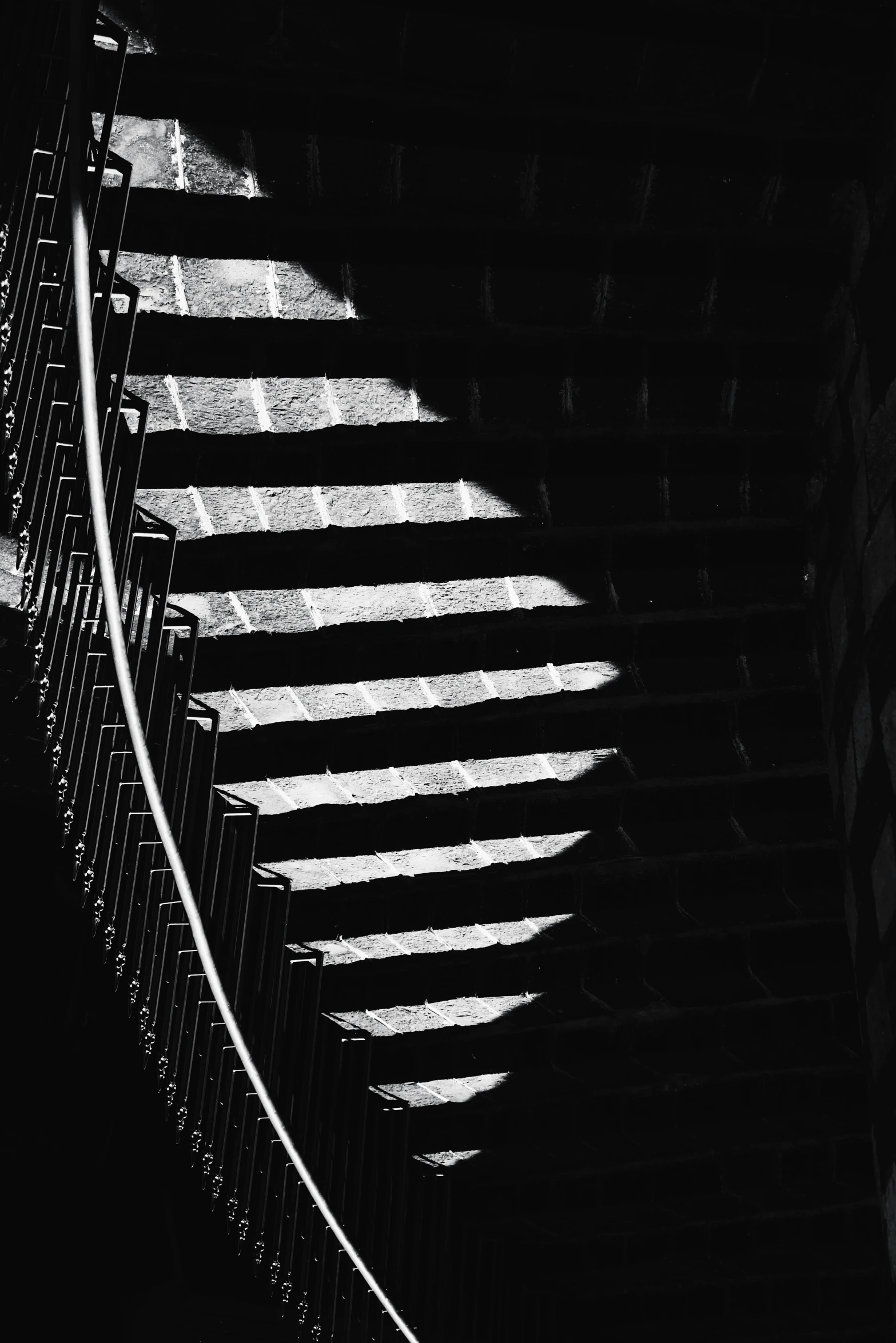 black and white pograph of the outside of a building with shadows