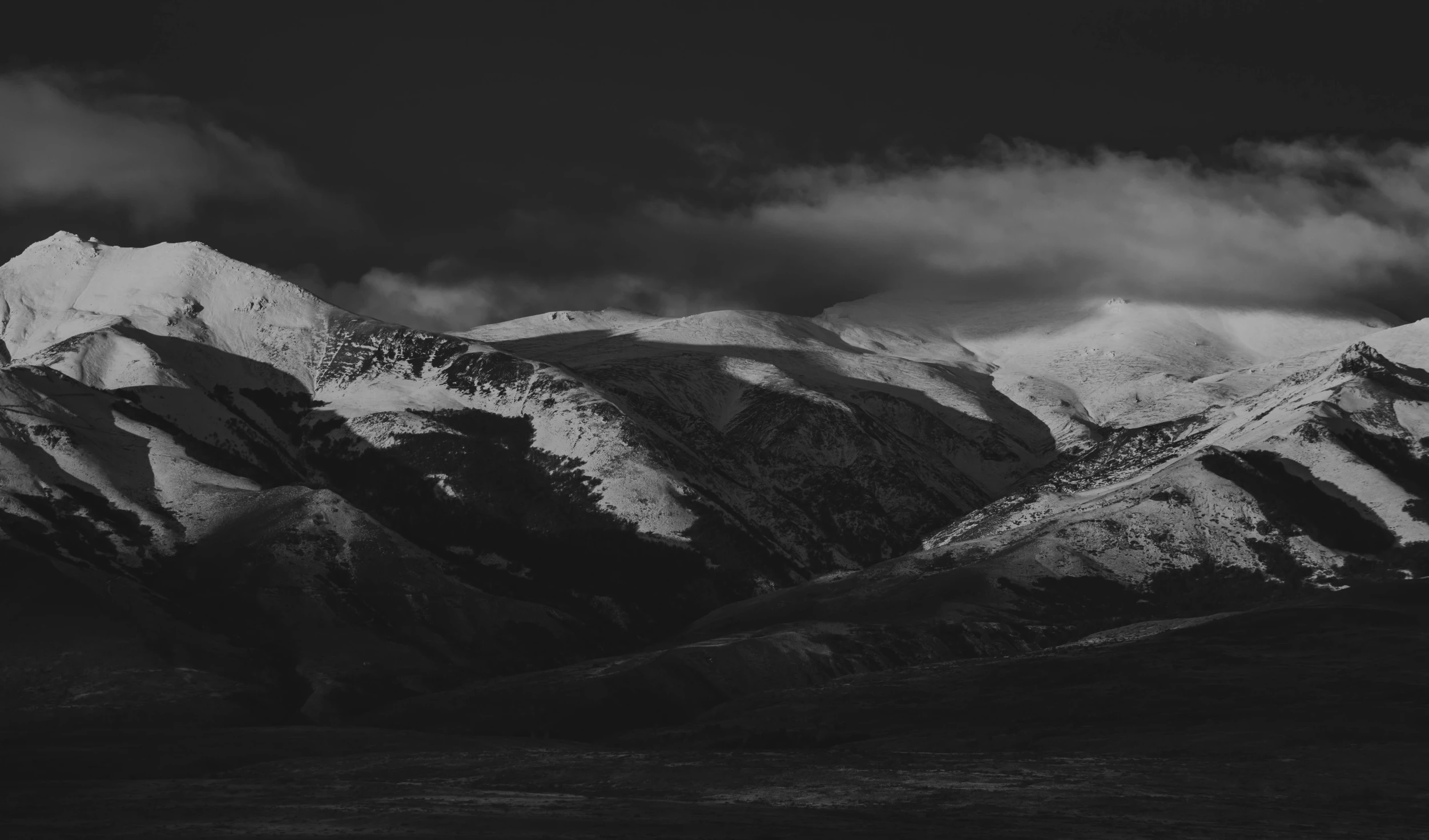 black and white pograph of the snowy mountains