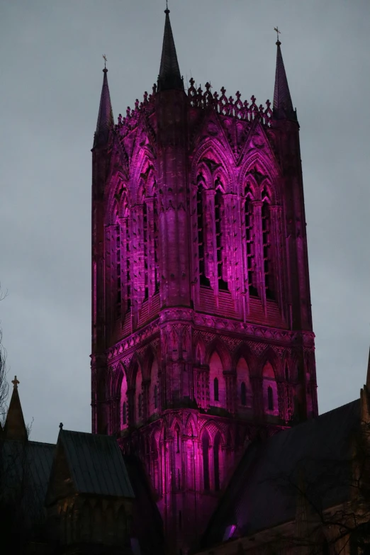 there is a tall tower that has a purple light on it