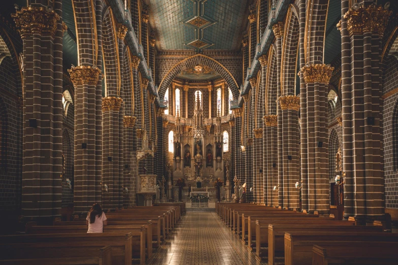 the inside of a cathedral with stained glass windows