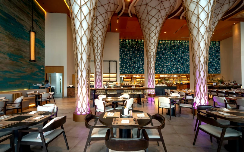 the interior of an indoor restaurant with round ceiling