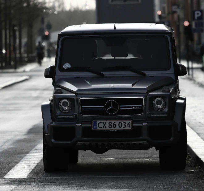 a large mercedes vehicle is parked on the street