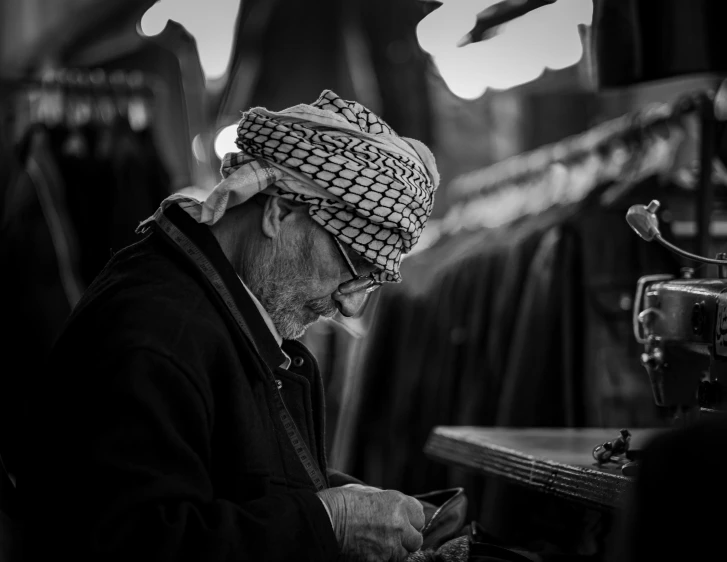 an old man working on soing in his workshop