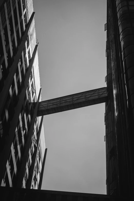 two large buildings next to each other against a blue sky