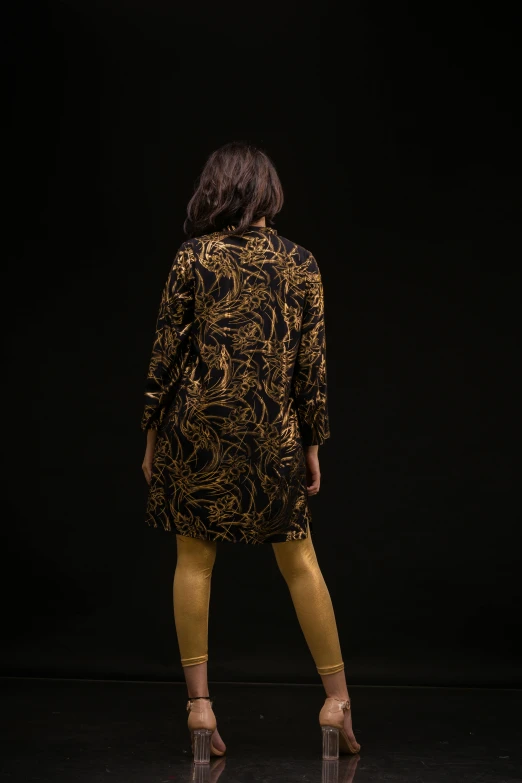 the back of a woman in tight yellow legs
