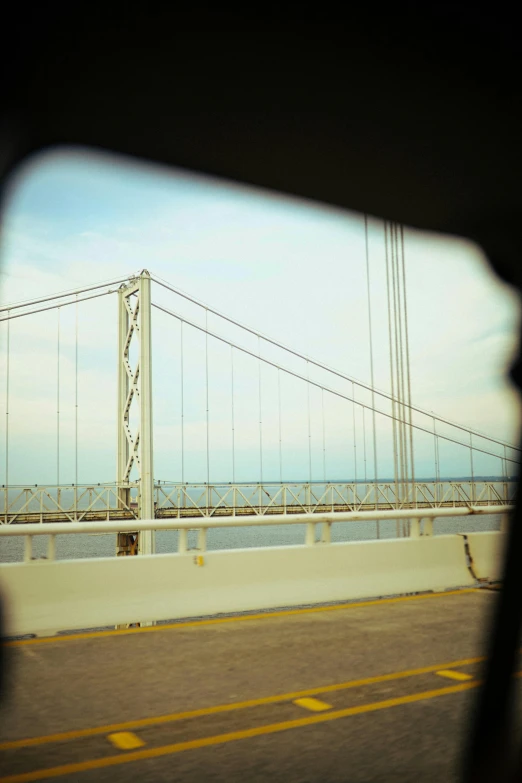 view of the san francisco oakland international bridge from inside a car