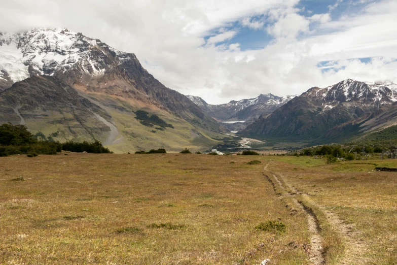 the trail is winding along a mountain side