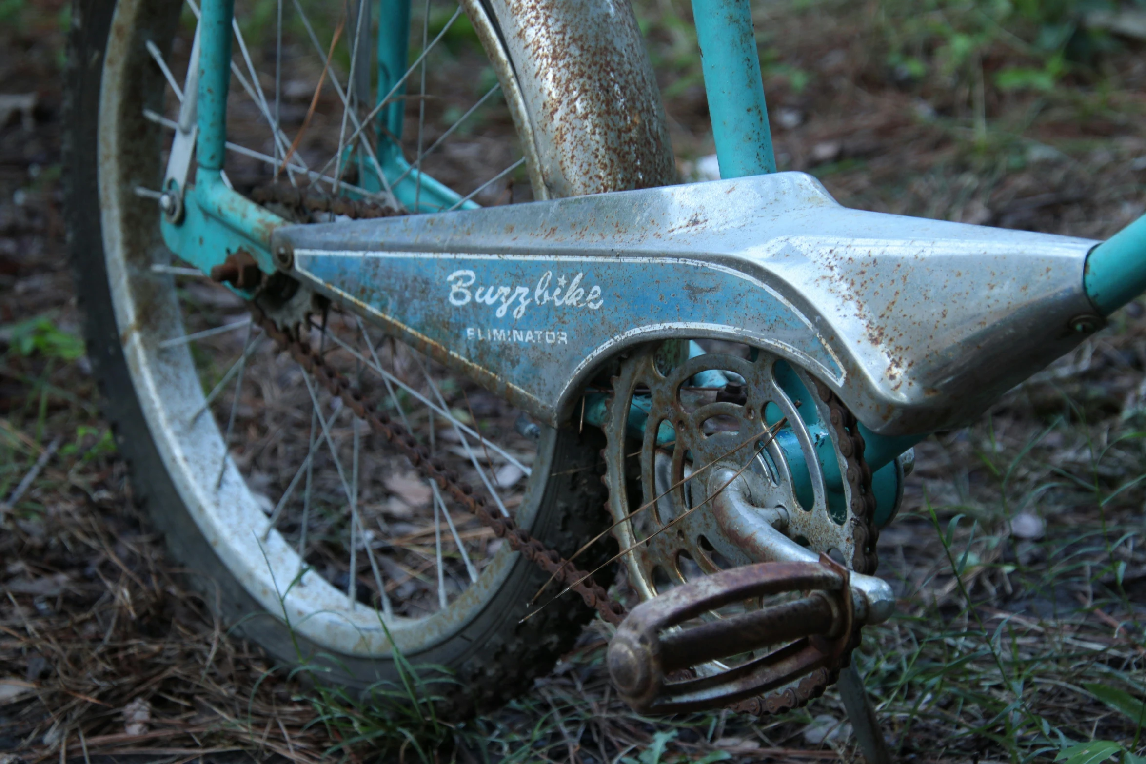 a blue bike is lying on the ground