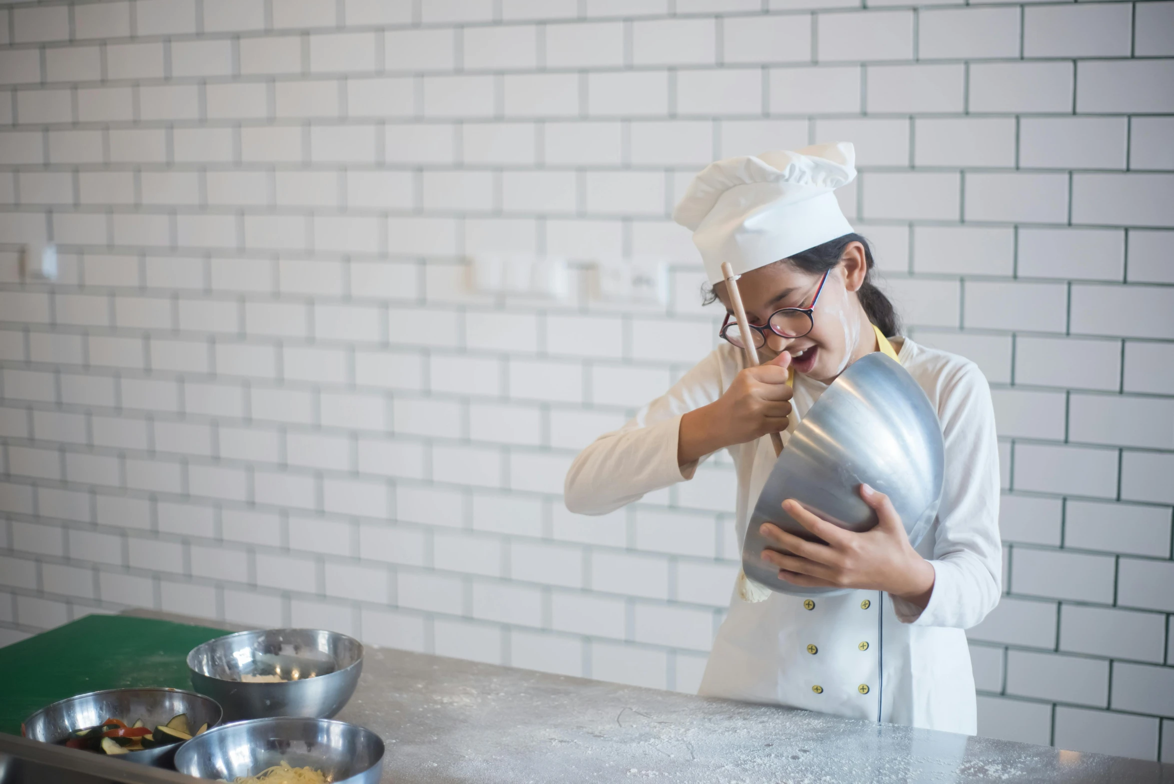 a  is working in the kitchen