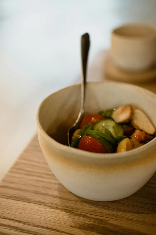 a bowl of food is shown on a  board