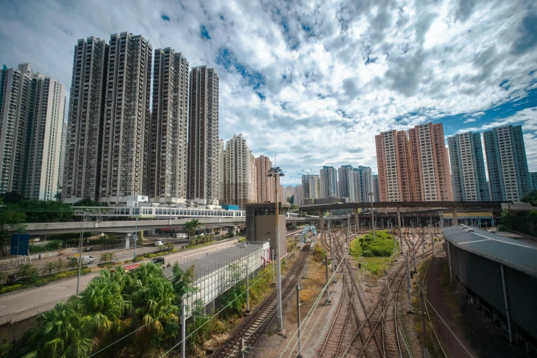 there are buildings next to train tracks in a city