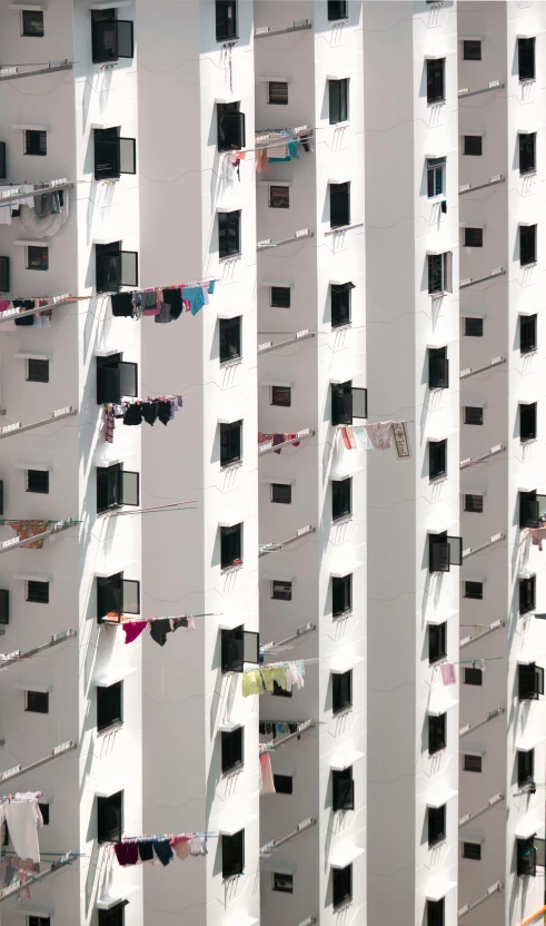 clothes hanging outside of building with large windows