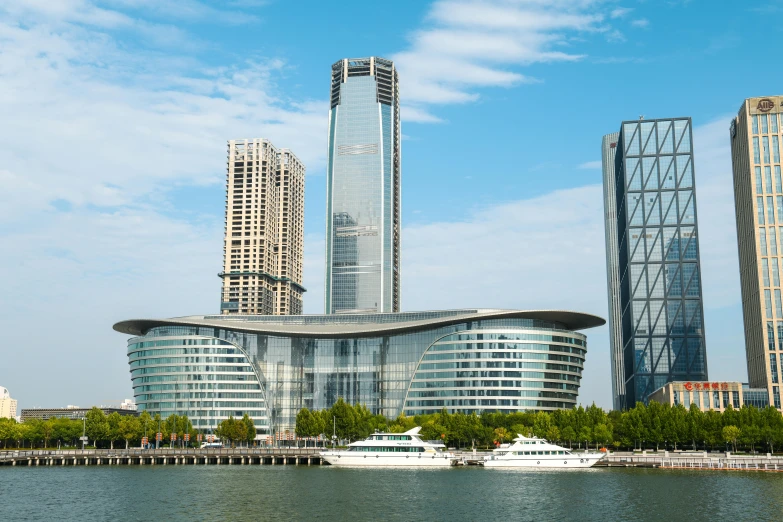 a view of some very tall buildings near a body of water