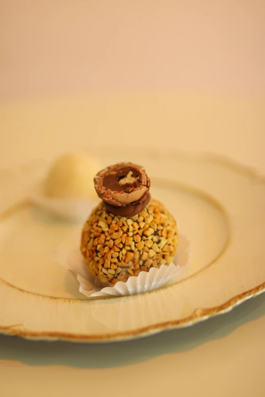 a chocolate pastry sitting on top of white plate