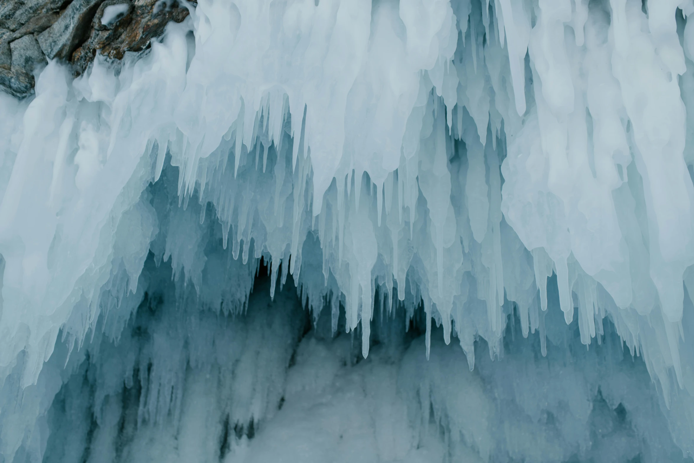 frozen water flows through a rock cave