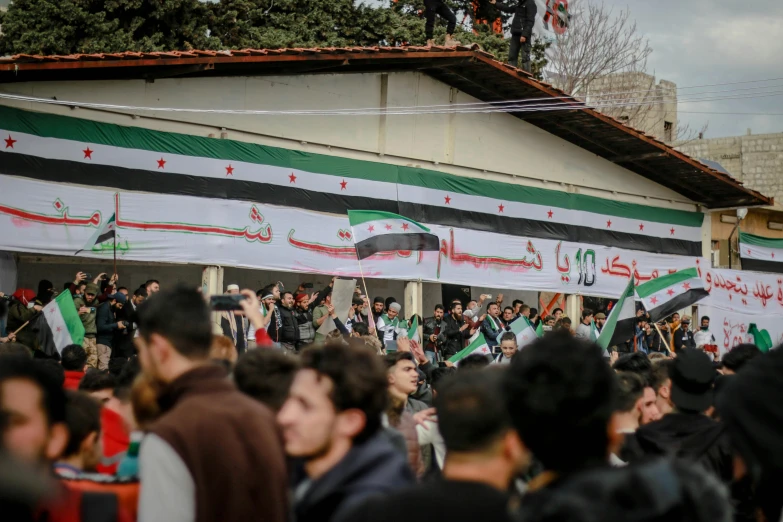 a group of people gathered in front of a building