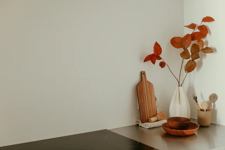 some small bowls and a vase are sitting on a shelf