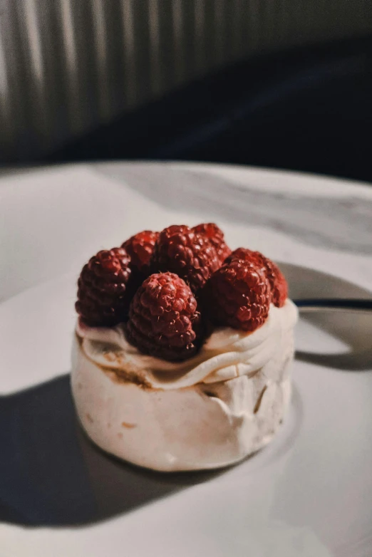 a dessert on a white plate with silverware