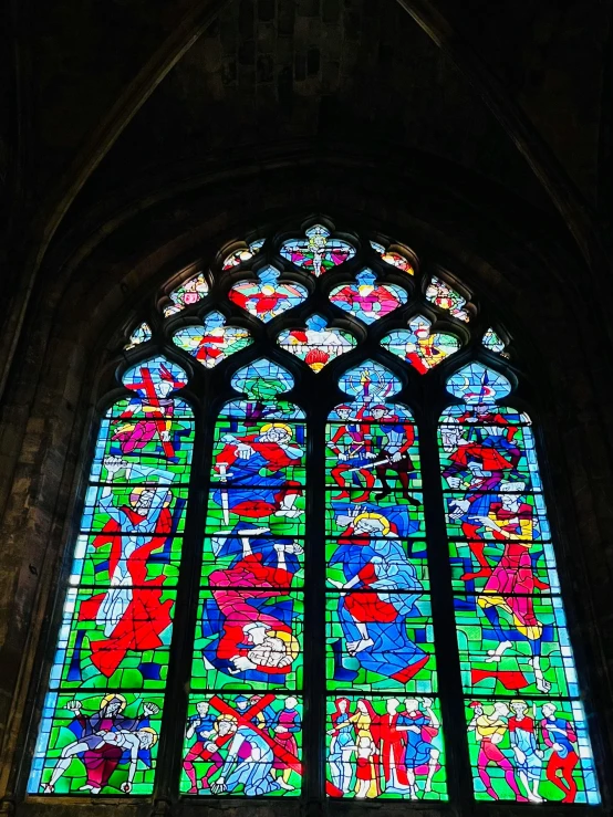 an stained glass window inside of a cathedral