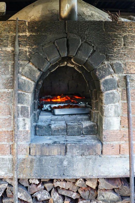 a pizza is cooking on a stone oven