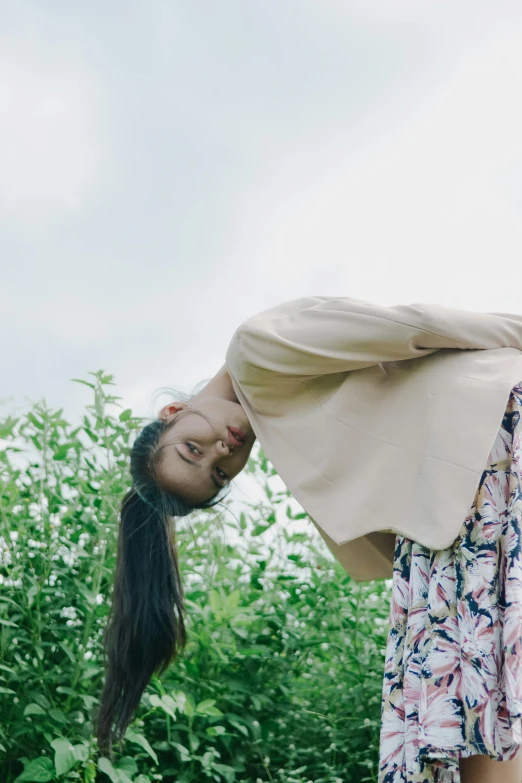 an image of a woman that is standing over her head