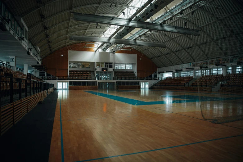 a large gym with hard wood floors and walls