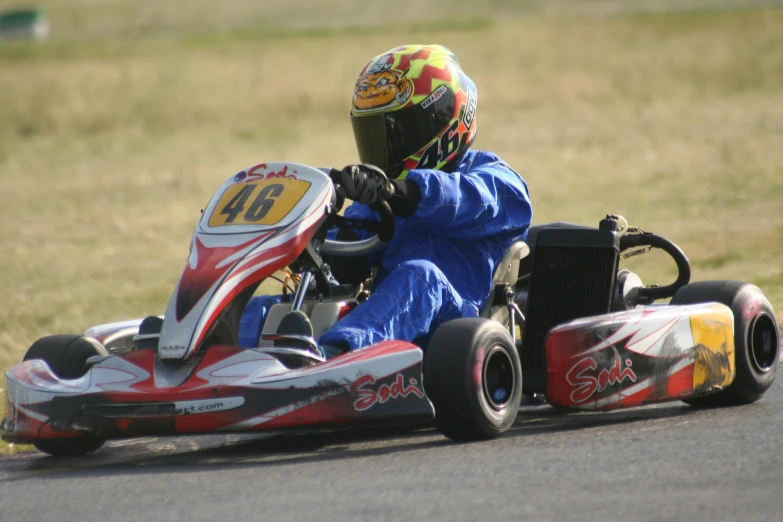 a  is driving a go kart car