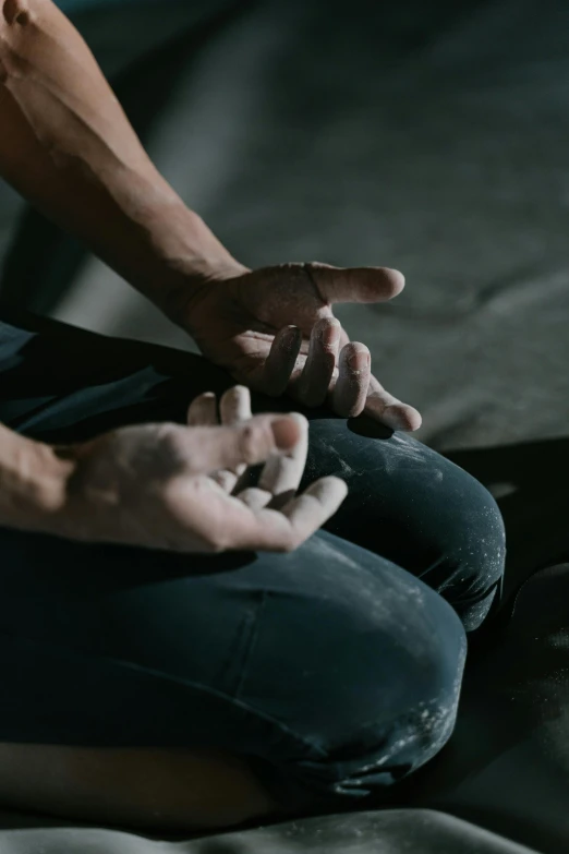 the man is sitting in lotus position doing yoga